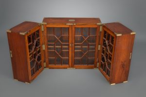 POLISHED TEAK FOLDING CAMPAIGN BOOKCASE, ENGLAND, C. 1810-20
