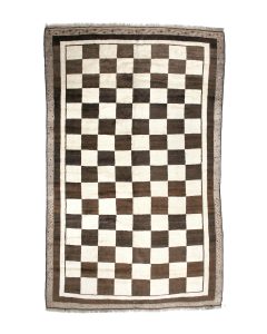 An unusually large Mid 20th c. Persian Gabbeh carpet in a black and white check design measuring 6 ft 7 in x 10 ft 4 in